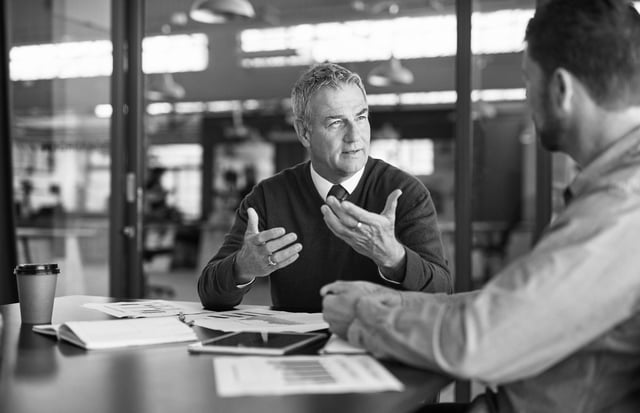 A physician talking a case through with an attorney